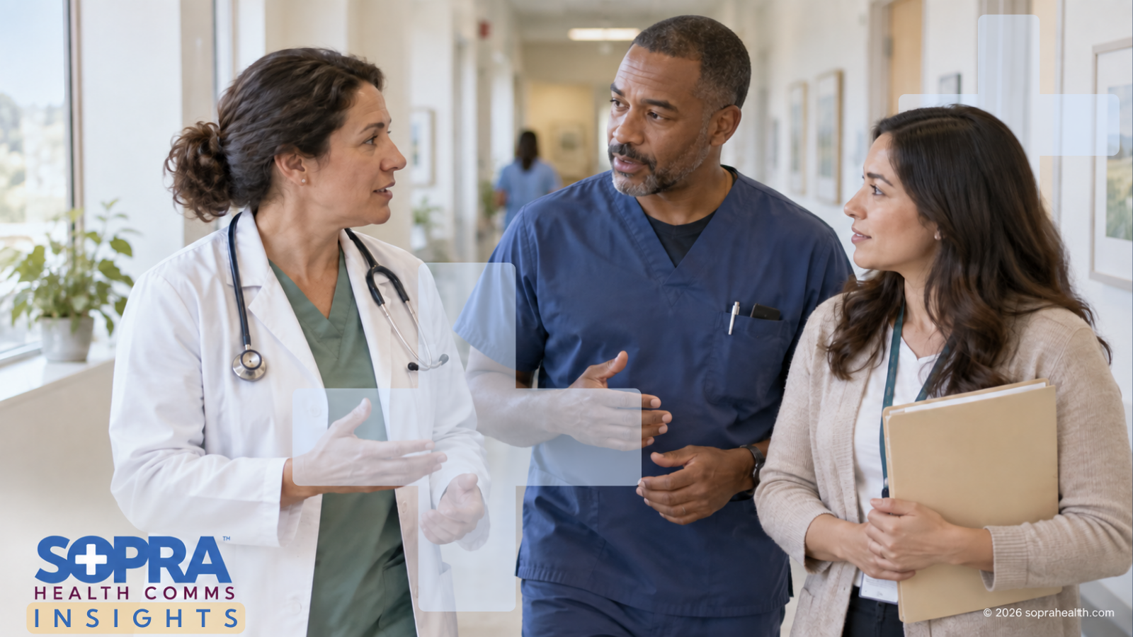 A doctor, practitioner and administrator walking in the hall of a healthcare facility while talking to each other - 103 hero sopra health insights