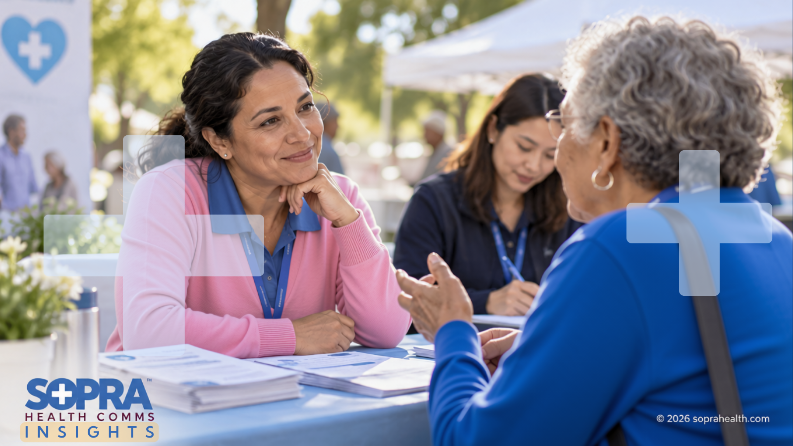 A health fair setting with a patient and practitioner having a discussion while sitting - 402 hero sopra health insights